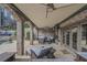 Covered brick patio with comfortable seating offers a great space for outdoor entertaining at 2380 Tayside Nw Xing, Kennesaw, GA 30152