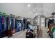 Spacious walk-in closet with hanging racks, shelves, center island, carpet, and chandelier lighting at 2380 Tayside Nw Xing, Kennesaw, GA 30152