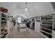 Spacious walk-in closet with custom shelving, clothing racks, and ample storage space for shoes and accessories at 2380 Tayside Nw Xing, Kennesaw, GA 30152