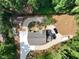 Aerial view of a home featuring a spacious driveway, deck, and mature landscaping, perfect for relaxing at 260 Lakemont Dr, Roswell, GA 30075