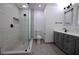 Bathroom featuring a glass shower, toilet, and vanity with modern fixtures at 260 Lakemont Dr, Roswell, GA 30075