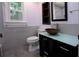 Bathroom with a unique bowl sink, modern vanity, and tiled wall behind the toilet at 260 Lakemont Dr, Roswell, GA 30075