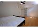 Large bedroom featuring hardwood floors, a vaulted ceiling, plenty of natural light, and a sliding barn door at 260 Lakemont Dr, Roswell, GA 30075