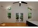Spacious bedroom with hardwood floors, a vaulted ceiling, natural light, and french doors to a private deck at 260 Lakemont Dr, Roswell, GA 30075