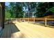 Spacious, newly built deck featuring wooden railings and a table and chairs, inviting outdoor relaxation and enjoyment at 260 Lakemont Dr, Roswell, GA 30075