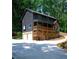 Three story home with two car garage and stone facade at 260 Lakemont Dr, Roswell, GA 30075