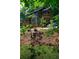 Three story home with covered porch surrounded by mature trees at 260 Lakemont Dr, Roswell, GA 30075