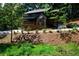 Three story home with a covered porch and stone facade at 260 Lakemont Dr, Roswell, GA 30075