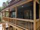 Close up of the wooden porch and railing with an ornate front door at 260 Lakemont Dr, Roswell, GA 30075