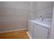 Bright laundry room featuring a full-size washer and dryer and metal shelving at 260 Lakemont Dr, Roswell, GA 30075