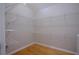 Spacious walk-in closet with wood floors and multiple levels of wire shelving at 260 Lakemont Dr, Roswell, GA 30075