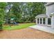 Secluded backyard with mature trees, a patio, and a playset at 3506 Billingsley Dr, Marietta, GA 30062
