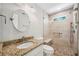Elegant bathroom with granite countertop, new fixtures, and glass-enclosed shower with seating at 3506 Billingsley Dr, Marietta, GA 30062