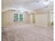 Large bedroom with neutral carpet, natural light, and pitched ceilings at 3506 Billingsley Dr, Marietta, GA 30062