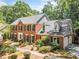 Traditional brick home with black shutters and a manicured lawn, creating a welcoming curb appeal at 3506 Billingsley Dr, Marietta, GA 30062