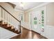 Inviting foyer showcasing hardwood floors, a staircase with carpet, and natural light at 3506 Billingsley Dr, Marietta, GA 30062