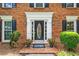 Elegant front door with decorative glass, flanked by potted plants and manicured bushes at 3506 Billingsley Dr, Marietta, GA 30062