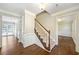 Spacious hallway with hardwood floors, staircase, and wainscoting at 3506 Billingsley Dr, Marietta, GA 30062