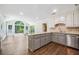 Bright kitchen with gray island, granite countertops and stainless steel appliances overlooking eat-in area at 3506 Billingsley Dr, Marietta, GA 30062