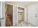 Well-organized laundry area with cabinet storage, utility sink, and access to stairs at 3506 Billingsley Dr, Marietta, GA 30062