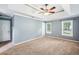 Inviting main bedroom with neutral tones, carpet, and a tray ceiling at 3506 Billingsley Dr, Marietta, GA 30062