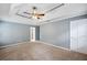 Cozy main bedroom with tray ceilings, recessed lights, and a neutral color palette at 3506 Billingsley Dr, Marietta, GA 30062