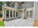 Rear patio featuring glass enclosed porch and sliding glass doors at 3506 Billingsley Dr, Marietta, GA 30062