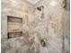 Beautiful, modern shower features custom tile and a built-in niche for storage at 3506 Billingsley Dr, Marietta, GA 30062