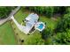 Aerial view of a two-story home with a pool, spa, patio, and long driveway at 2101 Thomas Rd, Canton, GA 30115