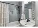 Bathroom featuring a shower-tub combination with gray tiling and a white vanity at 2101 Thomas Rd, Canton, GA 30115