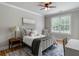 Comfortable bedroom with a metal-framed bed and a blue patterned rug at 2101 Thomas Rd, Canton, GA 30115
