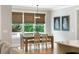Inviting dining area with large windows, stylish light fixture, and comfortable seating at 2101 Thomas Rd, Canton, GA 30115