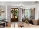 Warm and welcoming foyer featuring a rustic sliding barn door and elegant decor at 2101 Thomas Rd, Canton, GA 30115