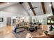 Spacious living room featuring a cathedral ceiling with wooden beams and open floor plan with hardwood floors at 2101 Thomas Rd, Canton, GA 30115