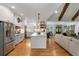 Open concept kitchen and living room featuring a large island, stainless steel appliances, and hardwood floors at 2101 Thomas Rd, Canton, GA 30115