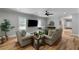 Inviting living room featuring hardwood floors, neutral walls, and comfortable seating with an abundance of natural light at 2101 Thomas Rd, Canton, GA 30115