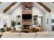 Comfortable living room with a brick fireplace, built-in shelving, wood beams, and plush seating at 2101 Thomas Rd, Canton, GA 30115