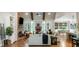 Spacious living room with a vaulted ceiling, brick fireplace, and open floor plan at 2101 Thomas Rd, Canton, GA 30115