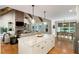 Spacious open floor plan with kitchen island, living room, and dining area, perfect for entertaining at 2101 Thomas Rd, Canton, GA 30115