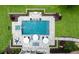 Aerial view of a pristine pool with spa, patio, firepit, and landscaped backyard at 2101 Thomas Rd, Canton, GA 30115