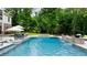 Beautiful pool with a swim up bar, water features, in-pool loungers and a patio with chairs at 2101 Thomas Rd, Canton, GA 30115