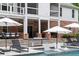 Backyard pool area with patio, ping pong table, lounge seating and lush landscaping at 2101 Thomas Rd, Canton, GA 30115