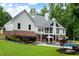Expansive home exterior featuring a pool, patio, and landscaped lawn at 2101 Thomas Rd, Canton, GA 30115
