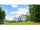 Expansive lush lawn surrounds this stunning rear exterior, perfect for outdoor entertaining and relaxation at 2101 Thomas Rd, Canton, GA 30115
