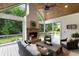 Inviting screened-in porch with a fireplace and comfortable seating for outdoor relaxation at 2101 Thomas Rd, Canton, GA 30115