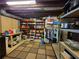Functional basement with storage shelves and cabinets on a checkered rug at 4094 Carlisle Pl, Stone Mountain, GA 30083