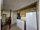 Basement with a freezer, refrigerator and built-in storage cabinets at 4094 Carlisle Pl, Stone Mountain, GA 30083