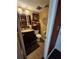 Traditional half bathroom featuring dark vanity, toilet and tile flooring at 4094 Carlisle Pl, Stone Mountain, GA 30083