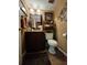 Cozy half bathroom features tile floor and dark-stained vanity at 4094 Carlisle Pl, Stone Mountain, GA 30083