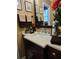 Stylish bathroom featuring a dark wood vanity cabinet and a solid surface countertop at 4094 Carlisle Pl, Stone Mountain, GA 30083